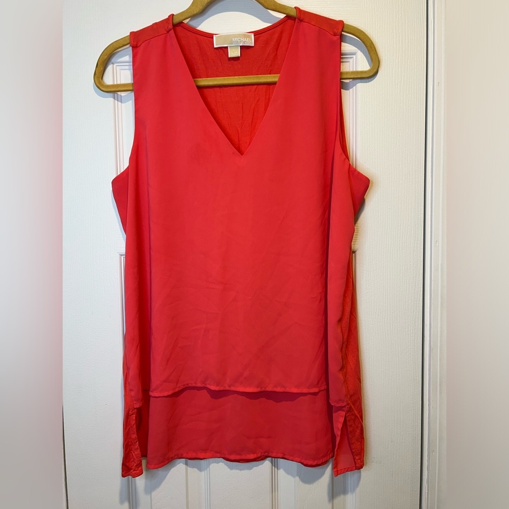 Michael Kors women’s top. More pink/coral than shown in the picture.